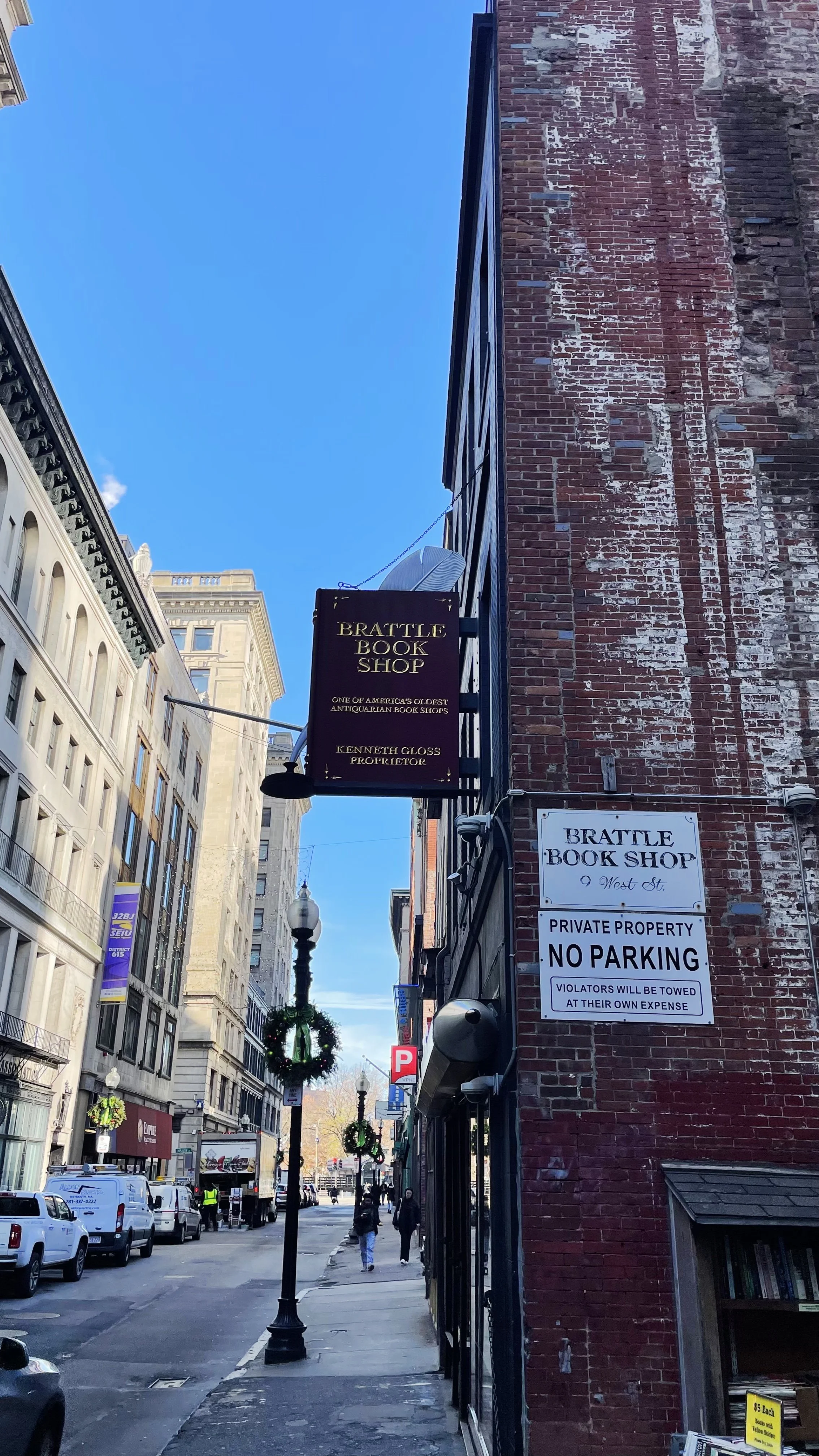 The maroon, gold-engraved sign above the door.