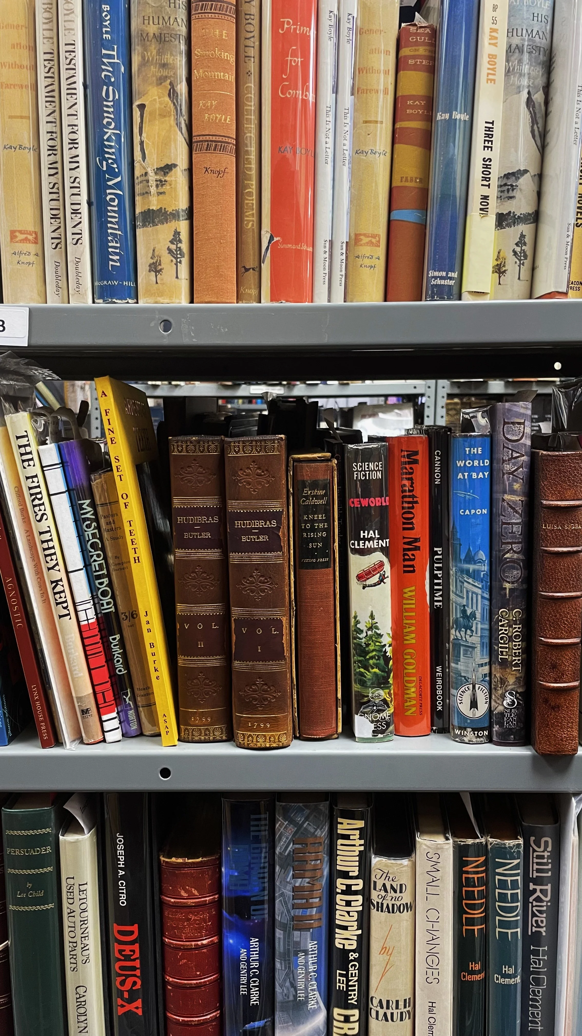 Antique books mixed with more recent titles.