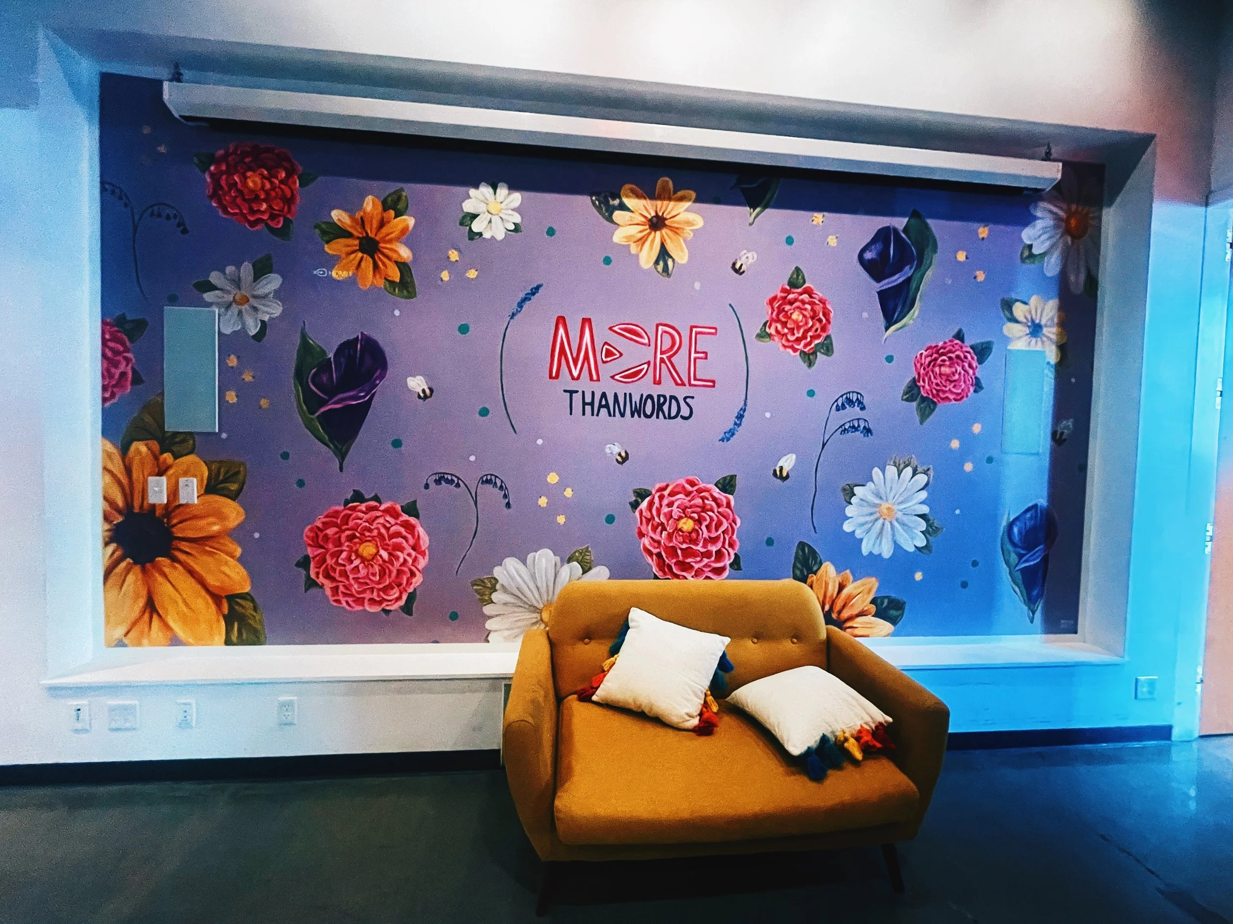 This is a beautiful purple mural towards the back of the store, that would make a perfect place to read.